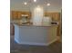Kitchen area featuring wood cabinets, appliances, and light-colored countertops at 3208 Regal Swan Pl # 3, North Las Vegas, NV 89084