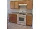 Kitchen showcasing light-colored cabinets, granite countertops, and essential appliances at 3208 Regal Swan Pl # 3, North Las Vegas, NV 89084
