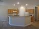 Spacious kitchen featuring ample storage, a breakfast bar, and modern appliances at 3208 Regal Swan Pl # 3, North Las Vegas, NV 89084