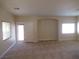Cozy living room boasting neutral carpet, paint, and lots of natural light from the windows at 3208 Regal Swan Pl # 3, North Las Vegas, NV 89084