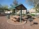 Enjoy a community picnic area with shaded seating and a grill for outdoor gatherings in a well-maintained space at 3208 Regal Swan Pl # 3, North Las Vegas, NV 89084