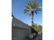 Elegant community entrance sign 'Courts at Aliante' with mature landscaping and swaying palms welcomes residents and guests at 3208 Regal Swan Pl # 3, North Las Vegas, NV 89084