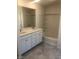 Bathroom features double sinks, white cabinets, and a shower-tub combination at 3270 Trabia Ave, Henderson, NV 89044