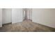 Carpeted bedroom with neutral walls, two doorways, and a view into the walk-in closet at 3270 Trabia Ave, Henderson, NV 89044