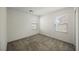 Empty bedroom with plush carpeting, natural light from two windows, and neutral walls at 3270 Trabia Ave, Henderson, NV 89044