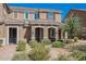 Charming townhouse with brick walkway, desert landscaping, and a well-maintained facade at 3270 Trabia Ave, Henderson, NV 89044