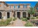 Inviting townhouse with brick walkway, desert landscaping, and a well-maintained facade at 3270 Trabia Ave, Henderson, NV 89044