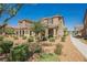 Attractive two-story home with manicured landscaping, offering a welcoming curb appeal in a community setting at 3270 Trabia Ave, Henderson, NV 89044