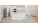 Modern kitchen with white cabinets, stainless steel appliances, and a large center island, great for cooking at 3270 Trabia Ave, Henderson, NV 89044