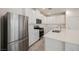 Modern kitchen with white cabinets, stainless steel appliances, and a large center island, great for cooking at 3270 Trabia Ave, Henderson, NV 89044