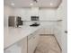 Well-lit kitchen showcasing quartz countertops, white cabinets, and stainless steel appliances at 3270 Trabia Ave, Henderson, NV 89044