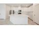 Modern kitchen with white cabinets, stainless steel appliances, and a large center island, great for cooking at 3270 Trabia Ave, Henderson, NV 89044