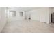Bright and open living room with neutral decor and large windows, creating a welcoming atmosphere at 3270 Trabia Ave, Henderson, NV 89044