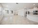Bright open-concept living room with white walls and modern tile flooring at 3270 Trabia Ave, Henderson, NV 89044