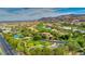 Beautiful aerial shot showcases the property's proximity to a golf course and mountain views at 383 Solitude Peak Ln, Henderson, NV 89012