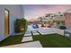 Beautiful backyard featuring an outdoor seating area, garden and swimming pool at 383 Solitude Peak Ln, Henderson, NV 89012