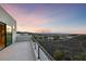 Balcony showcasing sunset views and desert landscaping at 383 Solitude Peak Ln, Henderson, NV 89012