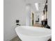 Spa-like bathroom showcasing a freestanding tub and elegant fixtures with a view of the ensuite at 383 Solitude Peak Ln, Henderson, NV 89012