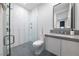 Stylish bathroom featuring a glass-enclosed shower and modern vanity with gray countertops at 383 Solitude Peak Ln, Henderson, NV 89012