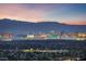 Expansive city skyline view featuring landmarks, set against a backdrop of mountains at 383 Solitude Peak Ln, Henderson, NV 89012