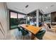 Bright dining room with views, featuring a modern table with comfortable seating and sleek lighting at 383 Solitude Peak Ln, Henderson, NV 89012