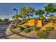 An eye-level shot of the Dragon Ridge Country Club entrance sign, showcasing its landscaping and architectural style at 383 Solitude Peak Ln, Henderson, NV 89012