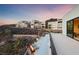 Modern home exterior with desert landscaping, fire pit, and patio at 383 Solitude Peak Ln, Henderson, NV 89012