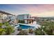 Contemporary home with a pool, spa, fire pit, and beautifully landscaped backyard at 383 Solitude Peak Ln, Henderson, NV 89012
