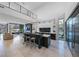 Open-concept kitchen with a large island, marble countertops, stainless steel appliances, and an open view to the desert at 383 Solitude Peak Ln, Henderson, NV 89012