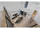 Aerial view of a modern kitchen with high ceilings, large island, and open floor plan leading to the staircase at 383 Solitude Peak Ln, Henderson, NV 89012
