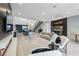 Spacious living area with modern decor, open to the kitchen and dining area with plentiful light at 383 Solitude Peak Ln, Henderson, NV 89012
