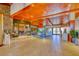 Lobby with wood and tile accents, with a gathering space in the background, creating a luxurious and welcoming atmosphere at 383 Solitude Peak Ln, Henderson, NV 89012