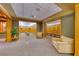 Comfortable locker room seating area showcasing carpet and wood trim, an inviting space for visitors at 383 Solitude Peak Ln, Henderson, NV 89012