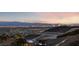 Stunning night view of the Las Vegas skyline and city lights from a hillside home at 383 Solitude Peak Ln, Henderson, NV 89012