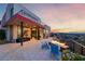 Outdoor patio and views, complete with a modern fire feature, a place to relax and enjoy at 383 Solitude Peak Ln, Henderson, NV 89012