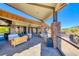 Outdoor patio space with stone pillars and comfortable seating, perfect for entertaining and enjoying mountain views at 383 Solitude Peak Ln, Henderson, NV 89012