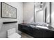 Chic powder room featuring marble countertop, modern art, and geometric tile backsplash at 383 Solitude Peak Ln, Henderson, NV 89012