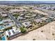 Aerial view of the property with desert landscaping, solar panels, and a paved driveway at 3906 Jacob Lake Cir, Las Vegas, NV 89118