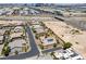Aerial view of a one-story house with desert landscaping, solar panels, and a multi-car driveway at 3906 Jacob Lake Cir, Las Vegas, NV 89118