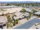 Aerial view of a single-story residence featuring desert landscaping, driveway, and solar panels at 3906 Jacob Lake Cir, Las Vegas, NV 89118