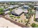 A stunning aerial view reveals a beautifully landscaped backyard with manicured green spaces and a charming patio area at 3906 Jacob Lake Cir, Las Vegas, NV 89118