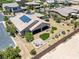A bird's-eye view highlights the backyard's unique design, complete with a stone patio, artificial grass, and desert plants at 3906 Jacob Lake Cir, Las Vegas, NV 89118