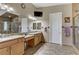 Main bathroom showcasing dual sinks, walk-in shower, and tiled flooring at 3906 Jacob Lake Cir, Las Vegas, NV 89118