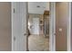 Hallway view into main bathroom with tiled floors and countertops at 3906 Jacob Lake Cir, Las Vegas, NV 89118