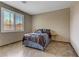 Bedroom featuring tiled floor and large window with blinds at 3906 Jacob Lake Cir, Las Vegas, NV 89118