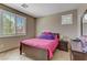 Bedroom featuring tiled floor and large window with blinds at 3906 Jacob Lake Cir, Las Vegas, NV 89118
