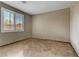 Bedroom featuring tiled floor and large window with blinds at 3906 Jacob Lake Cir, Las Vegas, NV 89118