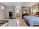 Comfortable bedroom area, complete with a large bed, small kitchen area, and relaxing sitting area at 3906 Jacob Lake Cir, Las Vegas, NV 89118
