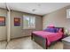 Cozy bedroom featuring neutral walls, tiled floor, and a comfy bed near a shuttered window at 3906 Jacob Lake Cir, Las Vegas, NV 89118