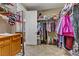 Spacious walk-in closet with ample storage, built-in shelving, and easy access to the bathroom at 3906 Jacob Lake Cir, Las Vegas, NV 89118